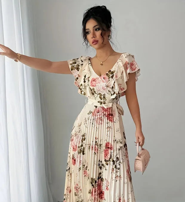 Apricot coloured V-neck floral print dress with ruffled sleeves and an oversized swing skirt
