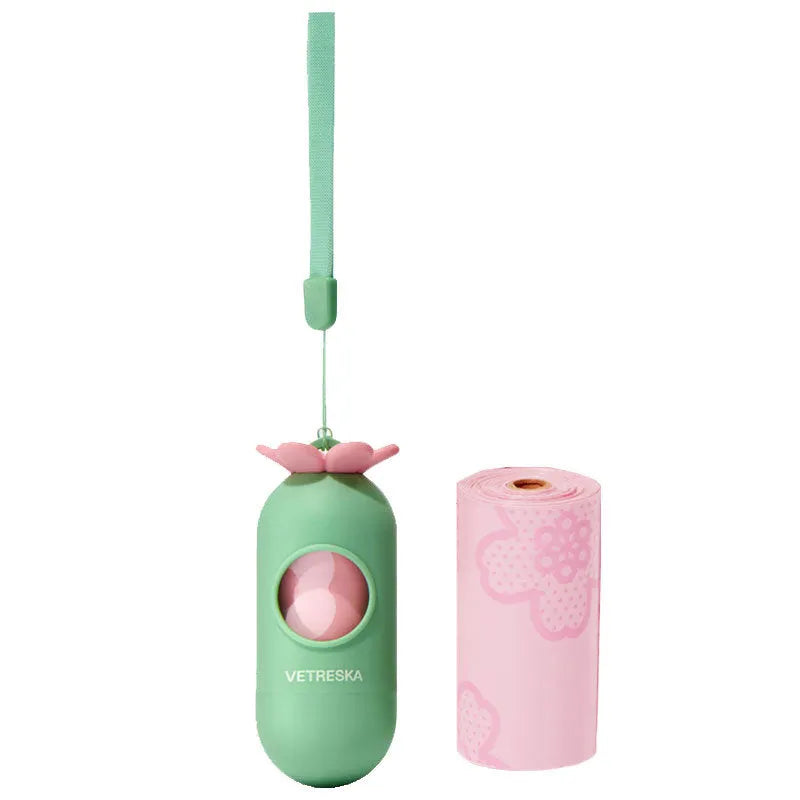 Colourful dog poo bag dispenser capsule with a roll of scented, biodegradable waste bags for dog walks