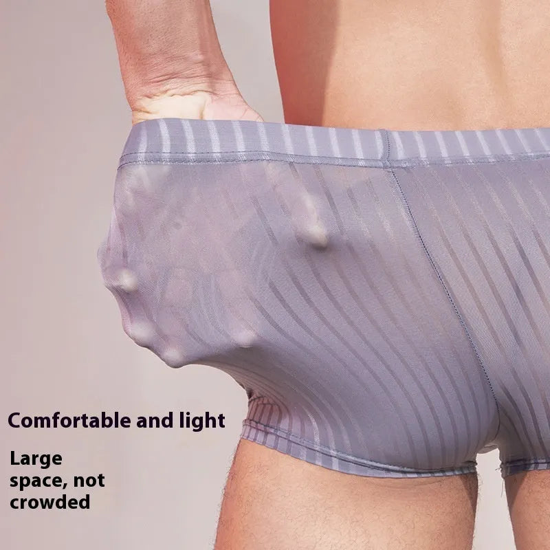 Men's black and white striped nylon underwear laid flat, showing thin fabric and free-size fit.