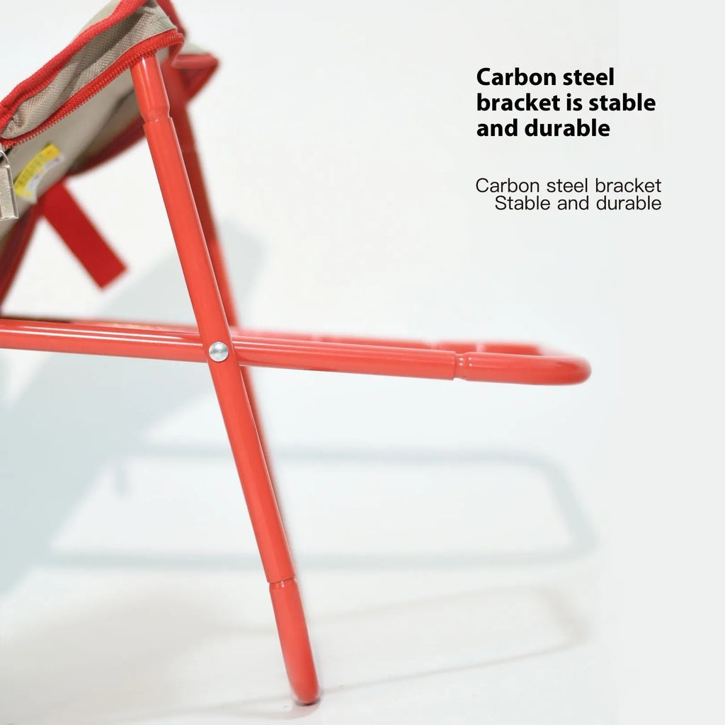A folded Oxford cloth camp stool in a pencil box design, shown in khaki colour.