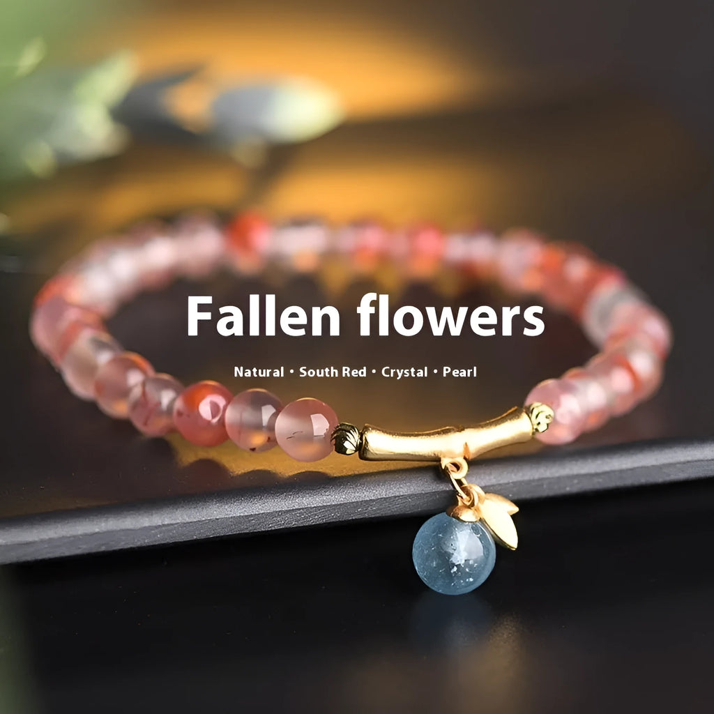 Polished Nanhong Agate flower bracelet with bamboo joint design on wrist.