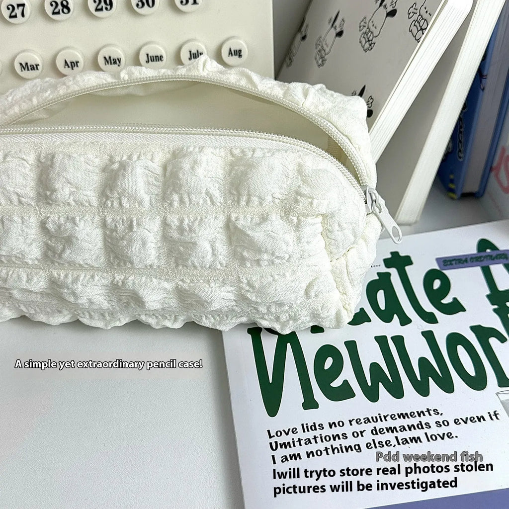 Fabric pencil case with cream puff design in beige colour option showing polyester material construction