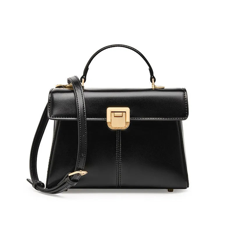 Women's black genuine vachette leather shoulder bag with clasp closure and 120cm strap.