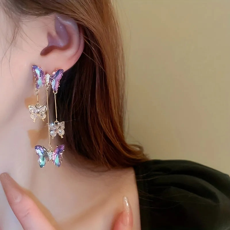 Silver Needle blue purple butterfly tassel earrings with crystal flowers on alloy chains, showing 7cm drop length.