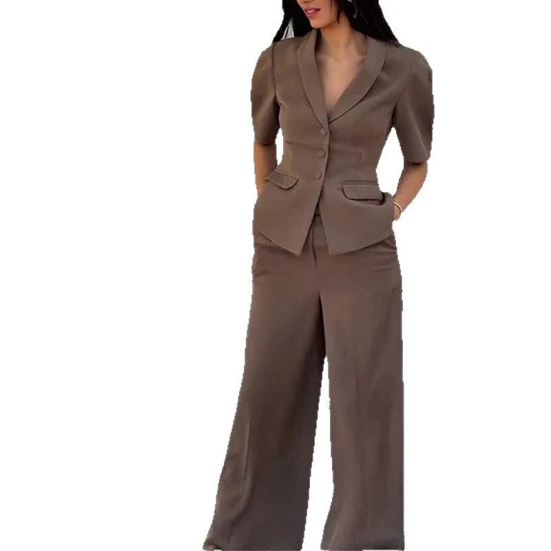 Brown men's slim fit polyester suit with long sleeve top and full length trousers on a hanger