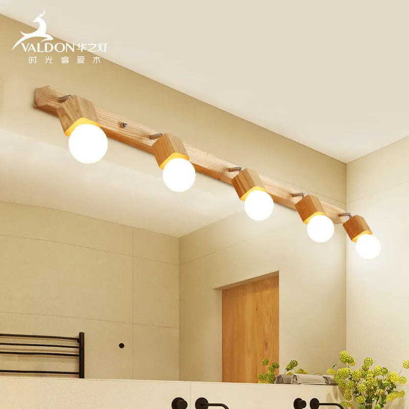 Single head 24cm LED wall lamp mounted beside a mirror.