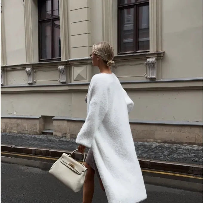 White knitted cardigan jacket for women with long sleeves and a loose fit.
