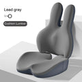 Ink black car seat cushion and lumbar support set on a driving seat.