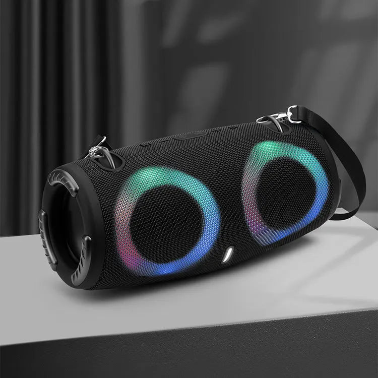War Drum portable Bluetooth speaker with multi-colour RGB lights, showing carry strap and waterproof casing.