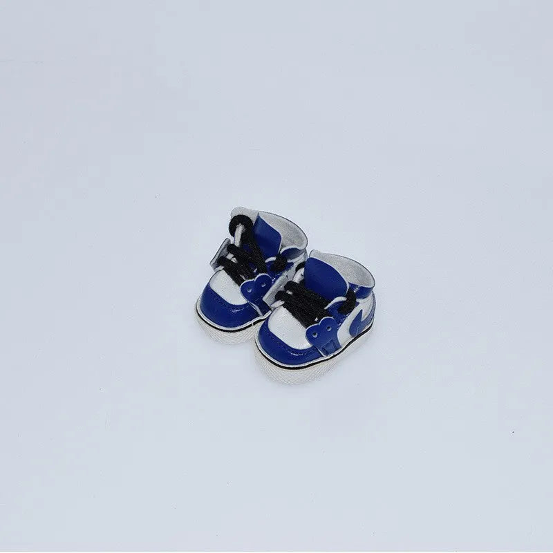 A pair of polyurethane doll shoe accessories for a 17cm figure, shown in a selected style and colour.