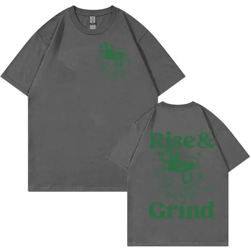 Rise And Grind Green Coffee cartoon graphic printed on a loose fit linen blend t-shirt.
