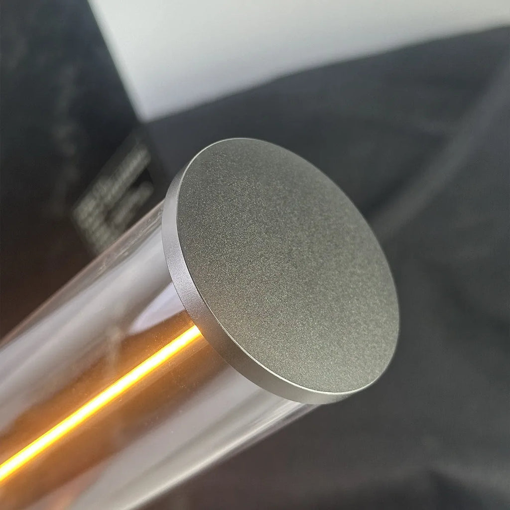 Slender glass LED light strip with magnetic base for USB charging night light.