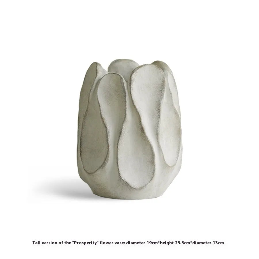 Irregular ceramic vase with resin flower device accents in magnesium clay material