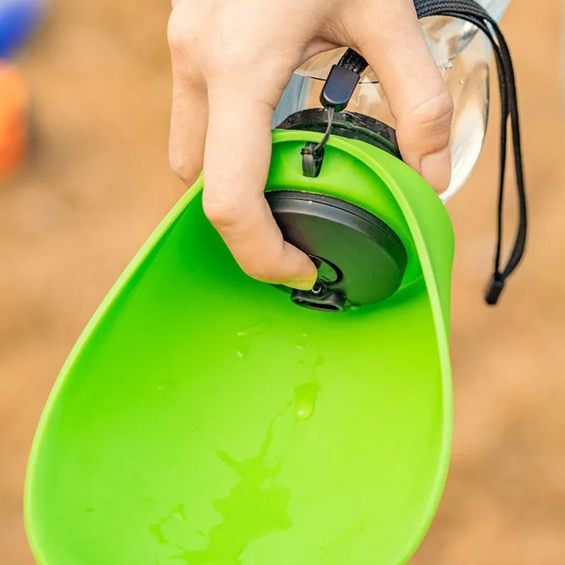 Blue plastic dog water bottle with built-in drinking bowl showing 680ml capacity and key lock mechanism