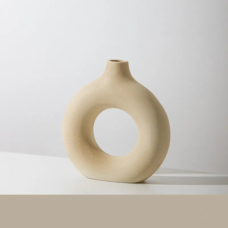 A simple modern frosted porcelain biscuit vase for flower arranging, shown in a neutral colour.