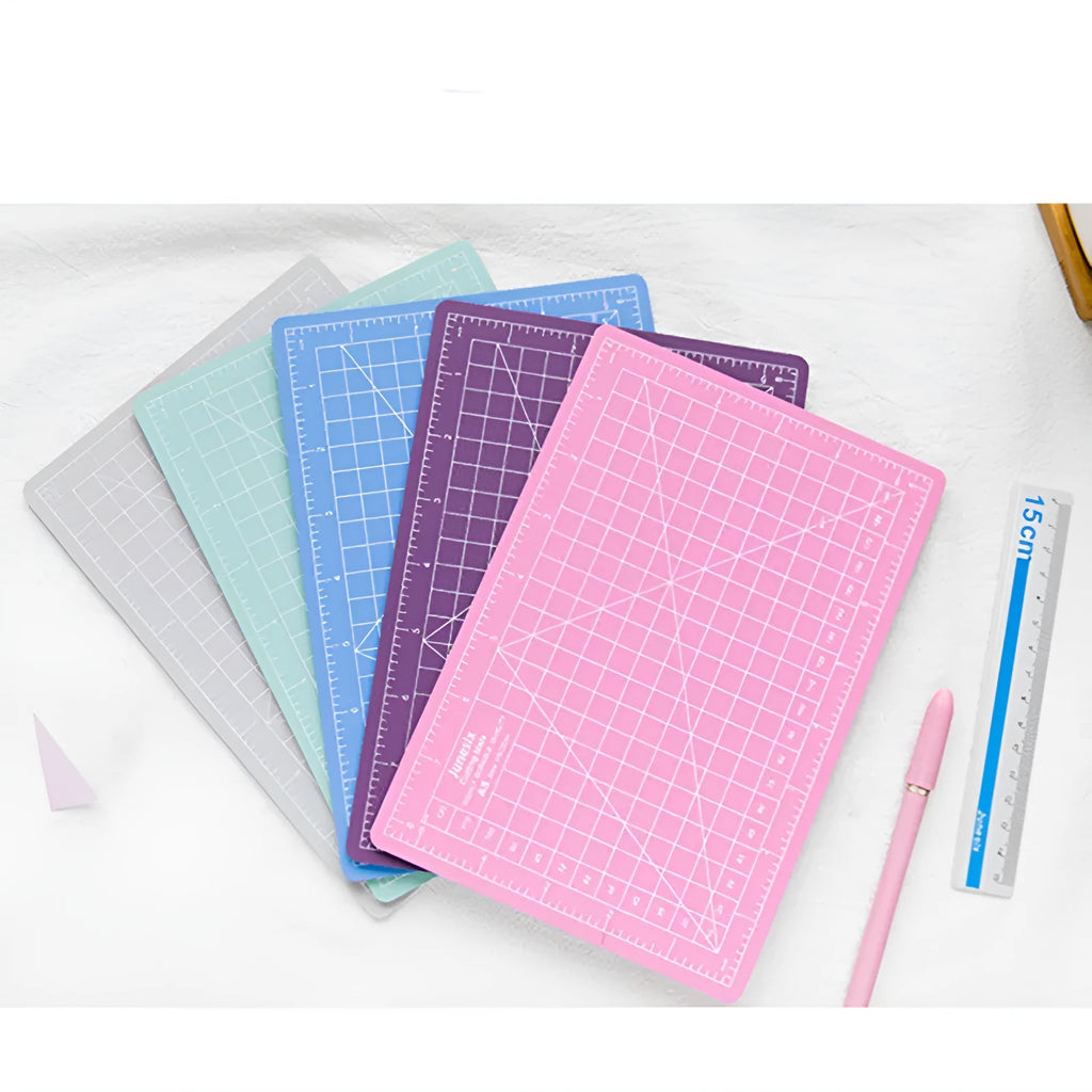 Art pen knife cutting board set in blue with backing board, ruler, pen sharpener and blade.