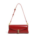 Women's leather cross-body bag with clamshell design and pillow shape in multiple colours