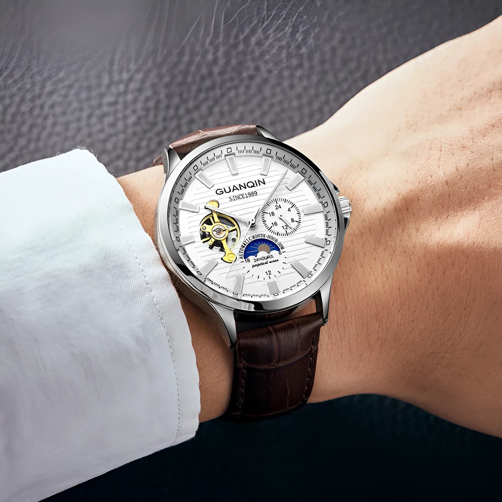 Men's automatic skeleton mechanical watch with 42mm dial, sapphire crystal glass, and genuine leather strap on a white background