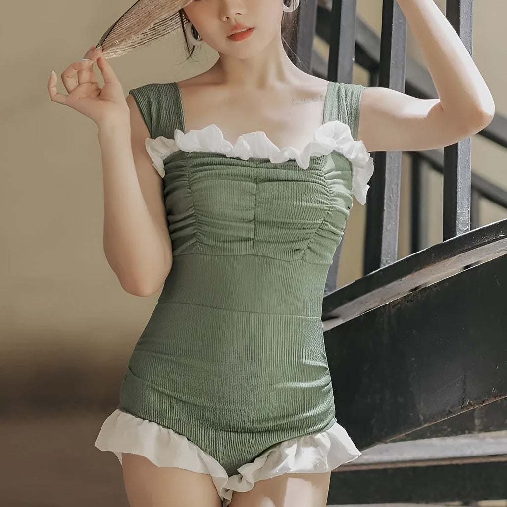 High-waisted one-piece swimsuit in quick-dry polyester fabric, shown in black.