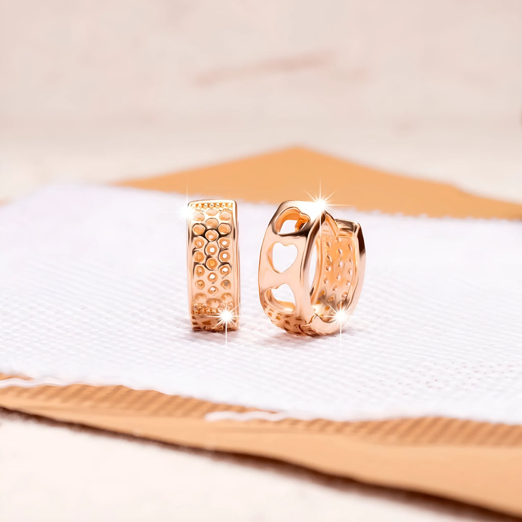 Rose gold women's earrings with three hollowed-out hearts in a circular, sweet style.