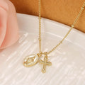 Geometric Virgin Mary cross pendant on a gold chain, showing simple design and 18K gold plating over copper.