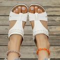 Pair of casual Roman style slippers with a fish mouth toe holder and slope heel, shown in a choice of colours.