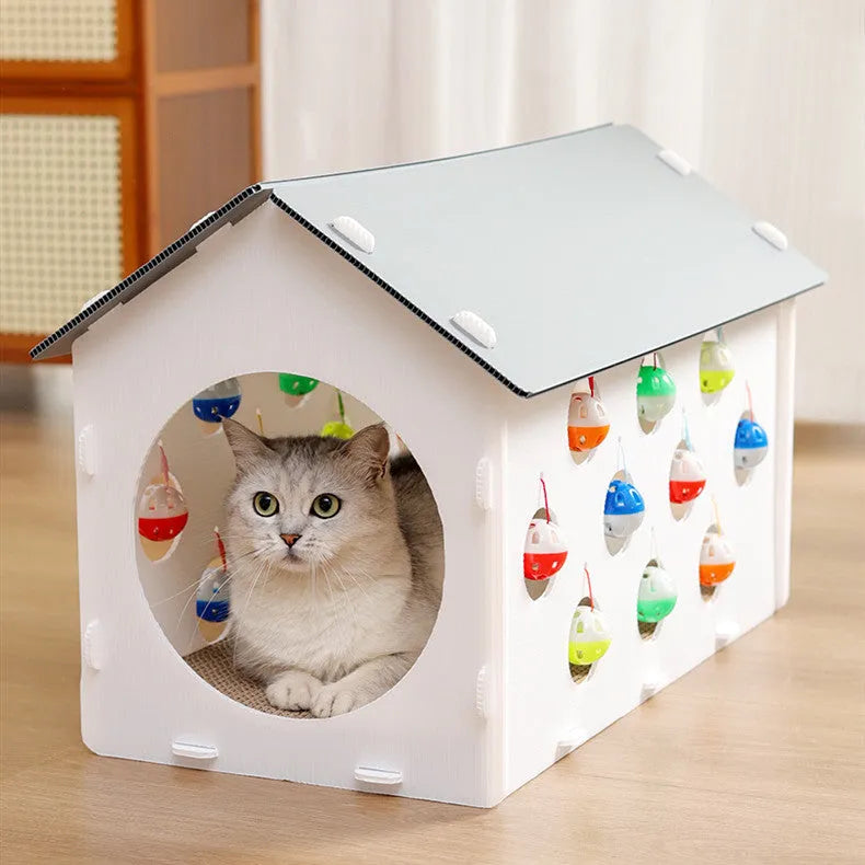 White plastic cat scratch board with integrated round nest bed and short tunnel with dangling bell ball