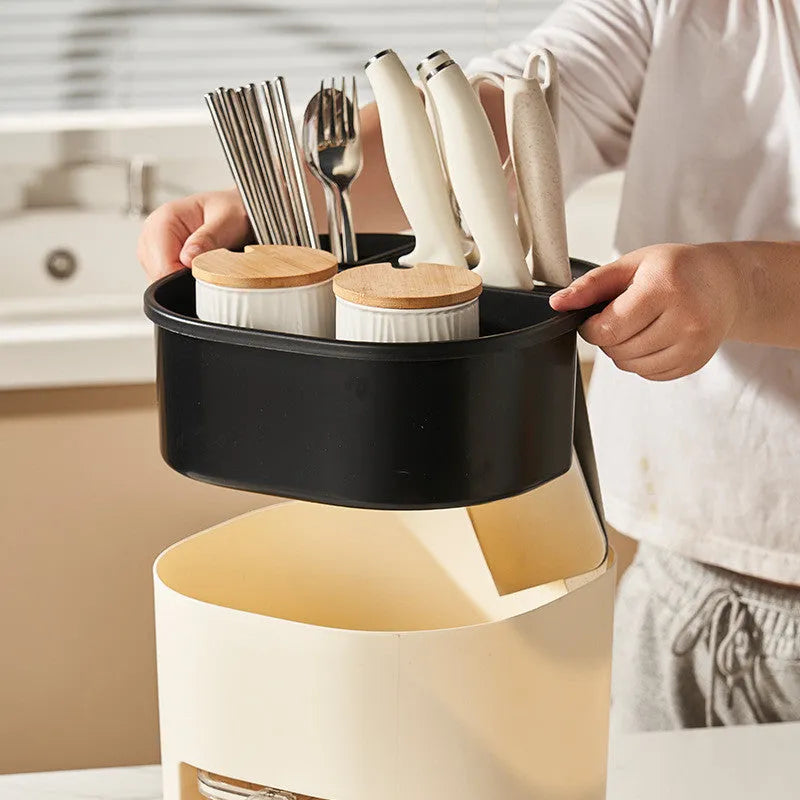 Rotating kitchen storage container with spice box organises utensils and seasonings
