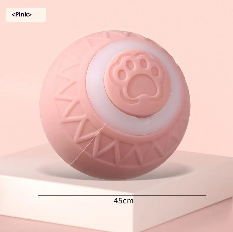 Blue and pink automatic rechargeable moving ball cat toy on a floor.