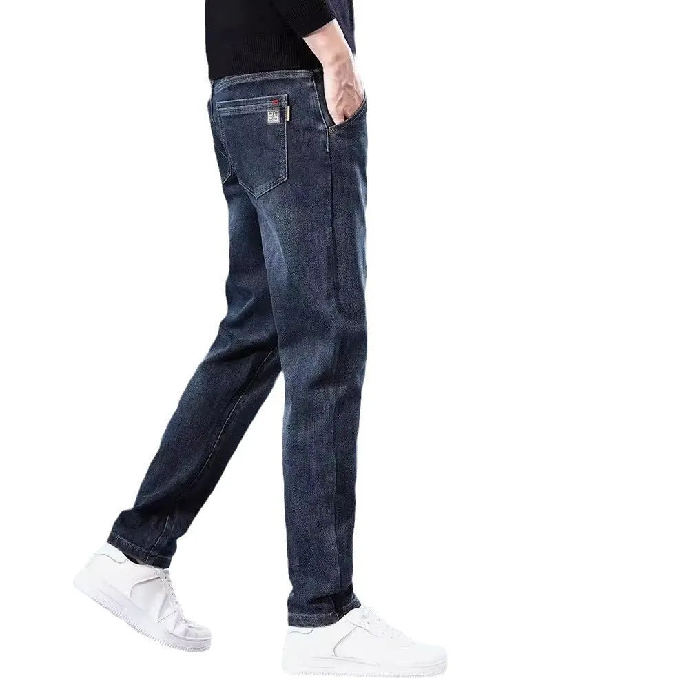 Men's slim straight casual trousers in blue grey and black colours, showing mid-waist and zipper fly detail.
