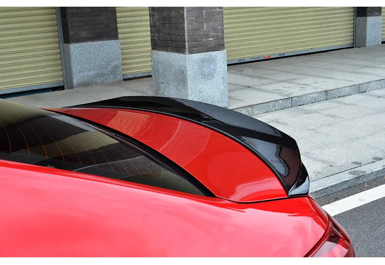 Bright black blade-style tail trim with large fixed wing spoiler for Mazda 3 Axela Exela Model 14-21.