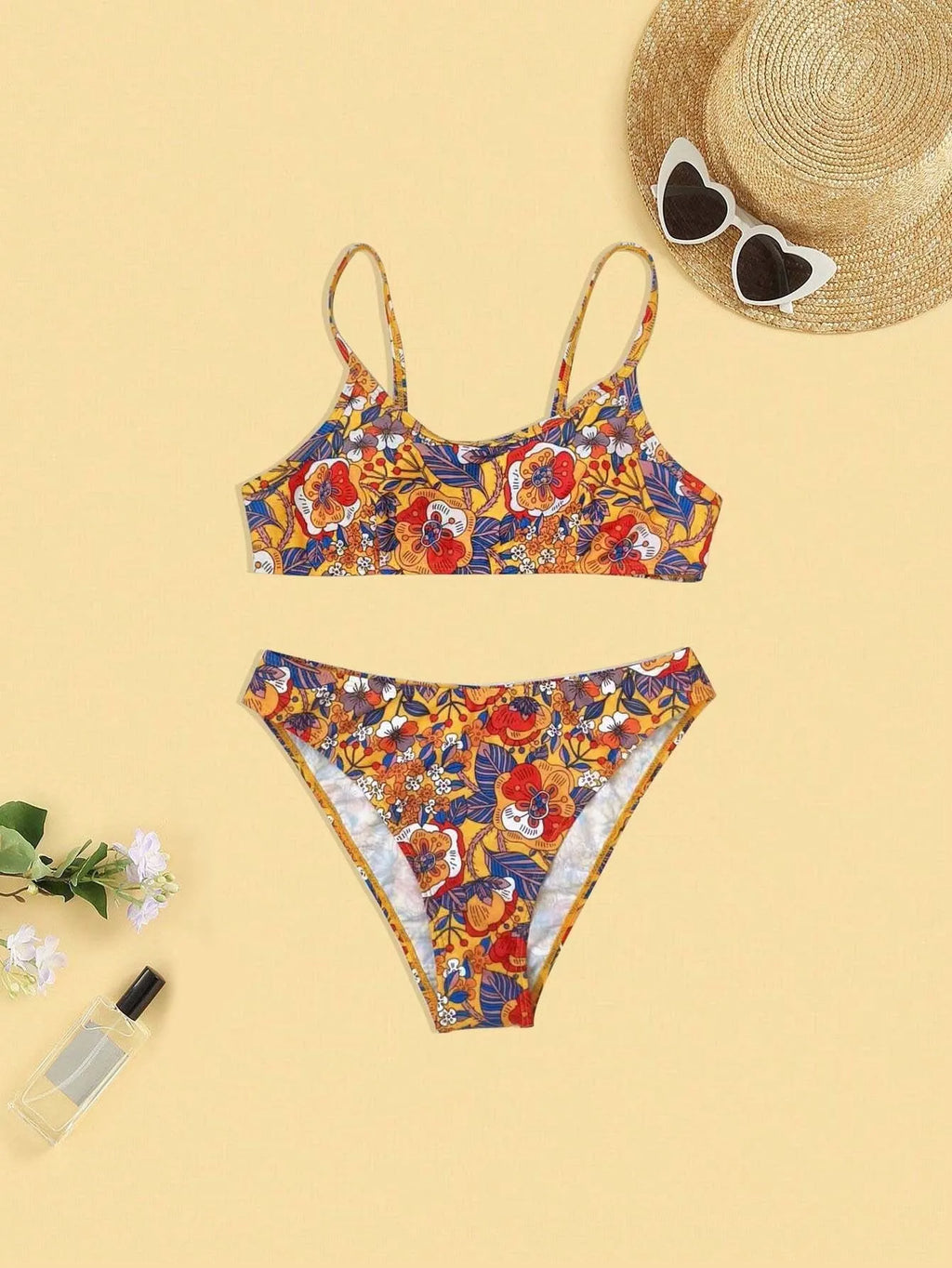 Plus size floral print strap women's bikini swimsuit with briefs style on a hanger.