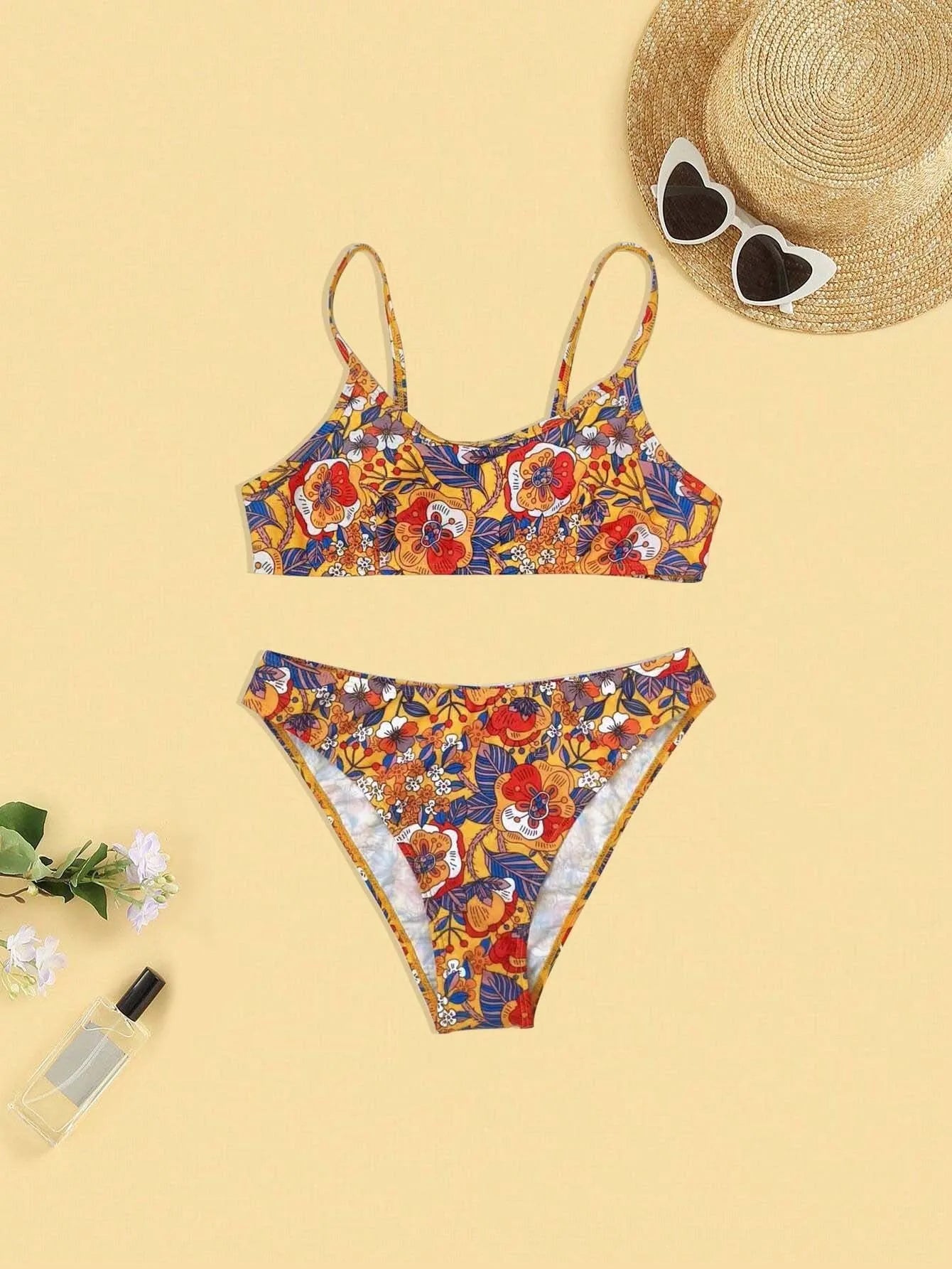 Plus size floral print strap women's bikini swimsuit with briefs style on a hanger.
