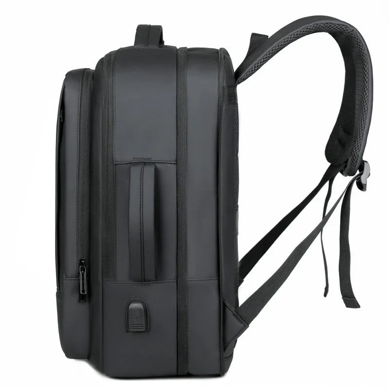 Large black waterproof backpack with curved shoulder straps for business travel and commuting
