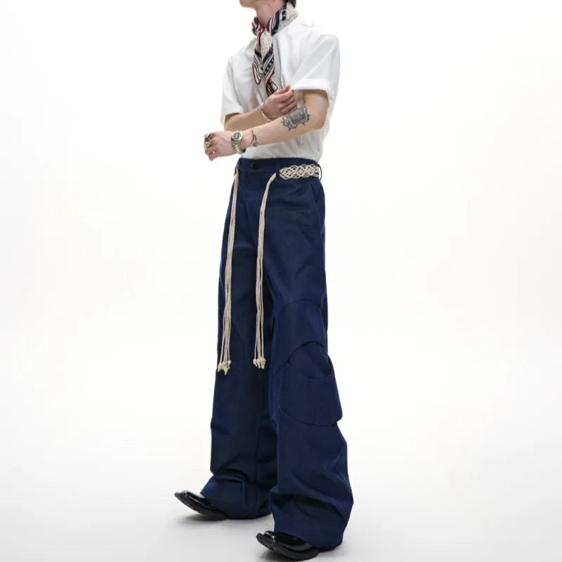 Men's dark blue straight-leg cotton jeans showing front view with zip fly and pocket detailing.