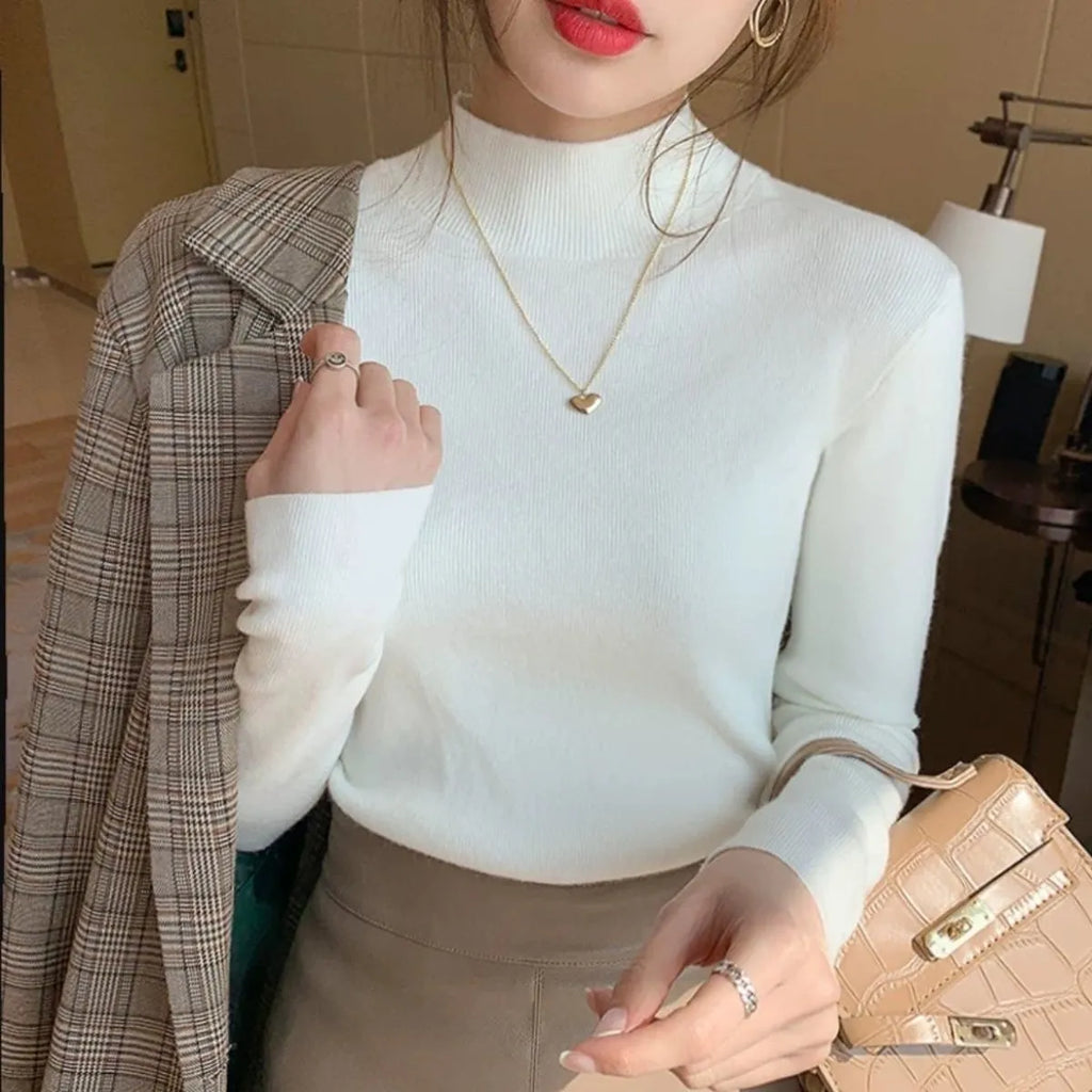 Slim fit knitted long sleeve bottoming shirt in viscose, shown in multiple colours.