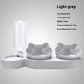 Dark blue plastic double bowl pet feeding set for dogs and cats on a plain background