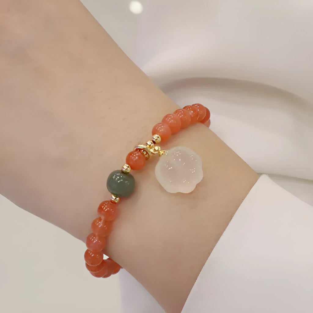 Women's bracelet with 8mm red agate cat's paw beads on a 6mm band.