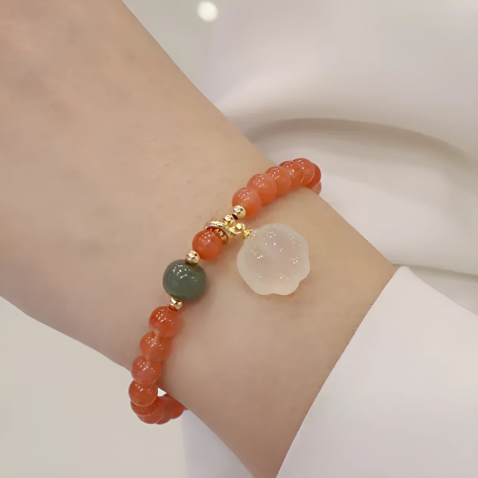 Women's bracelet with 8mm red agate cat's paw beads on a 6mm band.