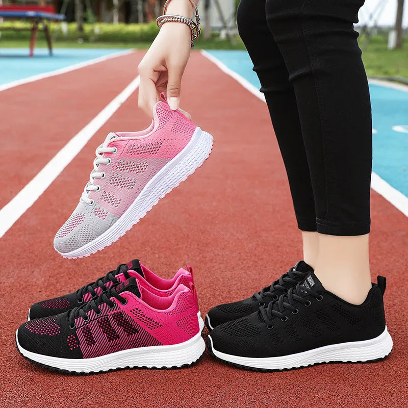 Women's Flyknit running shoes in black, rose red, and grey pink on a white background