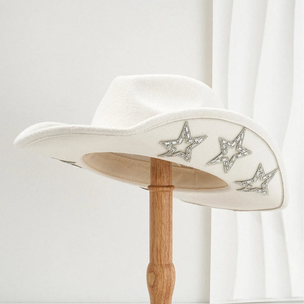 Beige wool felt western cowboy hat with a hexagonal star on the side, conical crown.