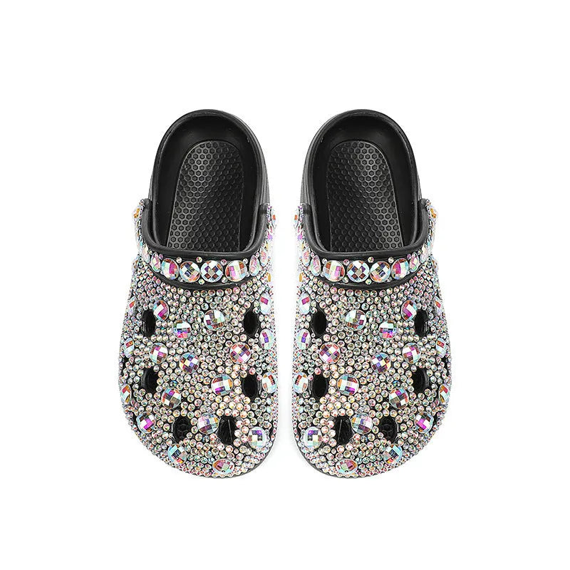 Black women's platform sandals with rhinestone detail on an EVA upper and a textured injection-moulded sole.