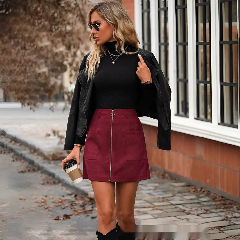 Women's high waist short skirt in black with stitching detail and a concealed side zipper.