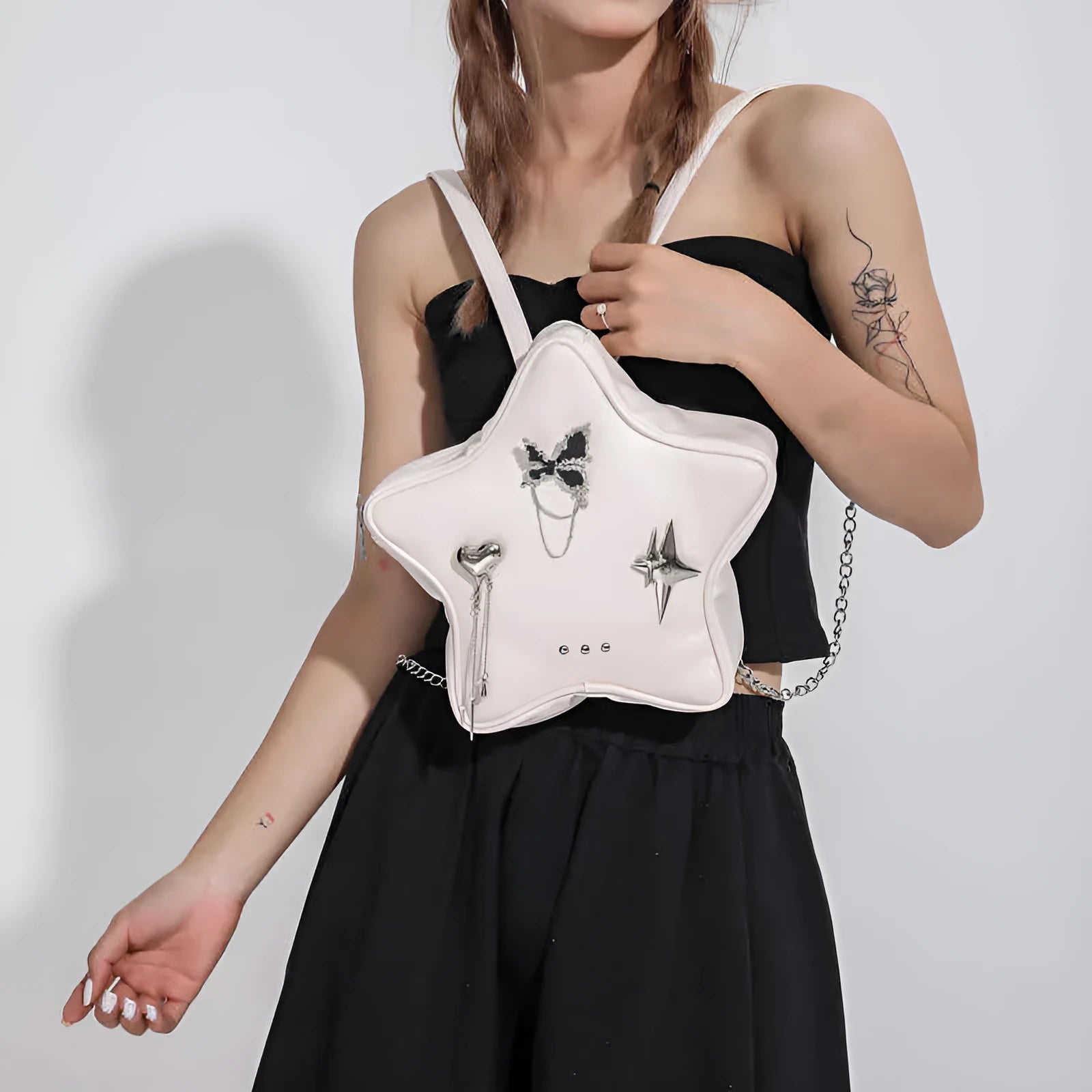 Women's soft PU leather mini backpack messenger bag in black, shown with crossbody strap