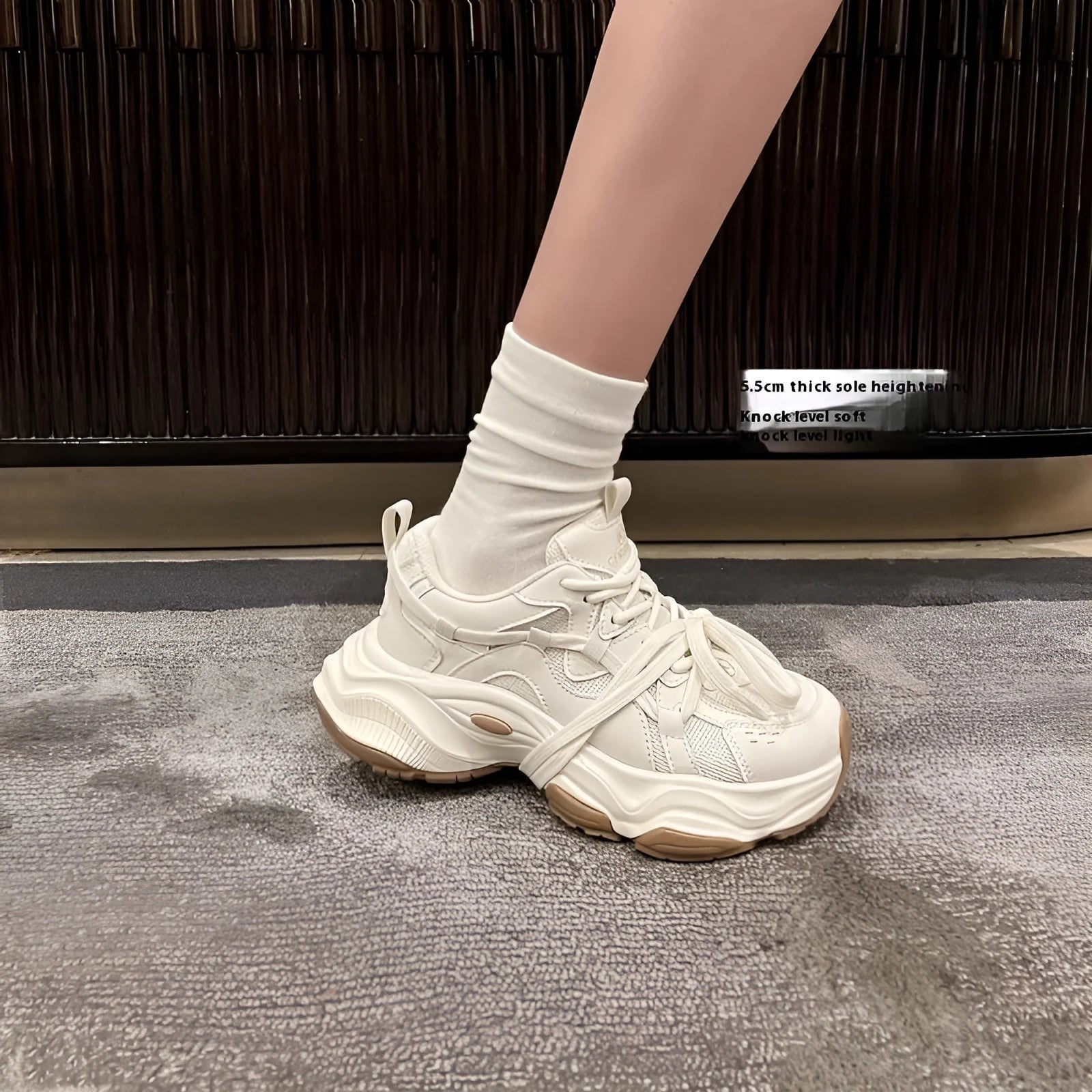 Beige women's platform heel dad sneakers with round toe and front lace-up fastening.