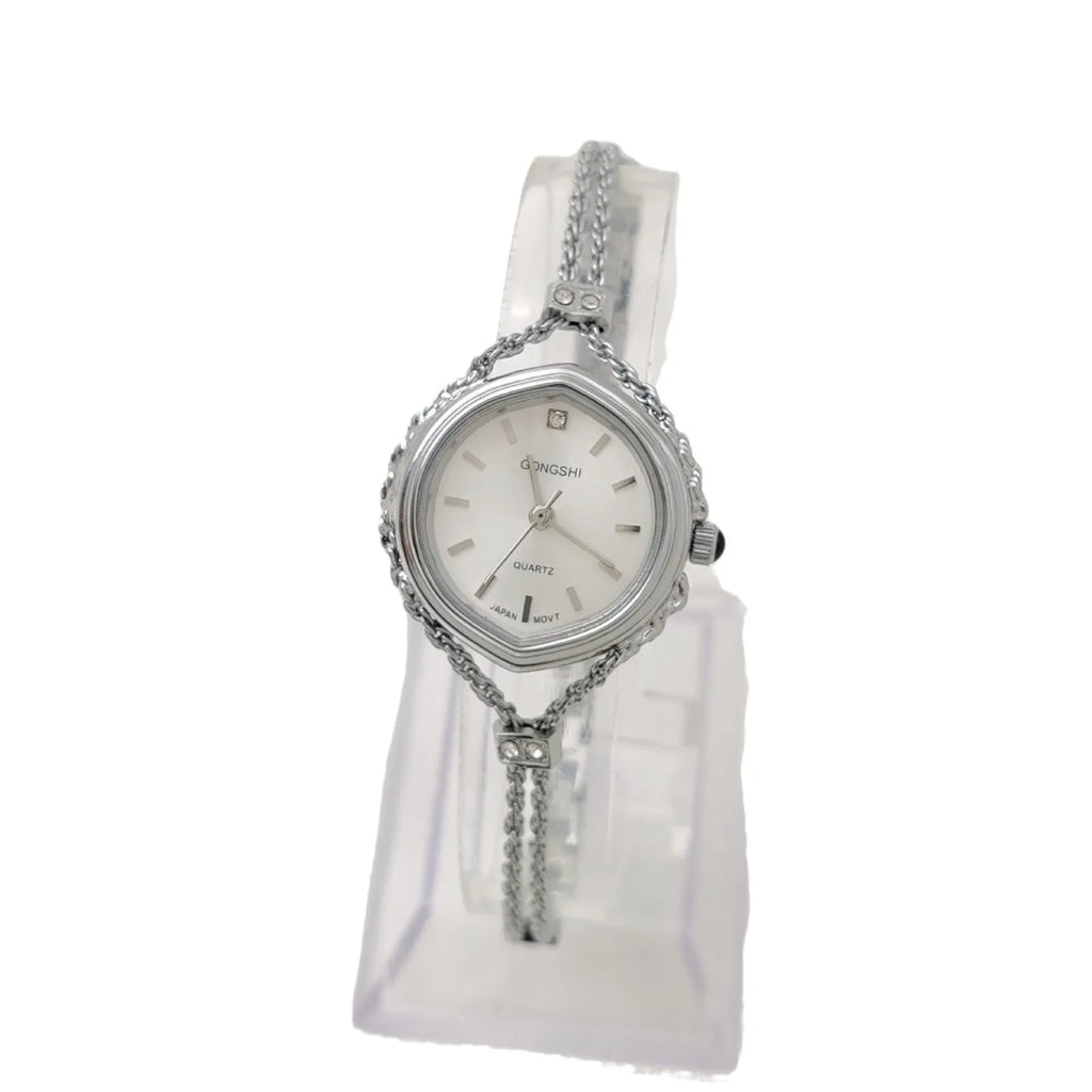 Gold and silver women's quartz watch with 25mm dial on a metal chain strap