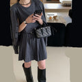 Women's grey knitted vest skirt and long-sleeve cardigan set with 3D pattern and an adjustable waist belt.