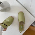 Women's flat sandals in retro fisherman style with animal pattern on canvas upper, shown in yellow colour.