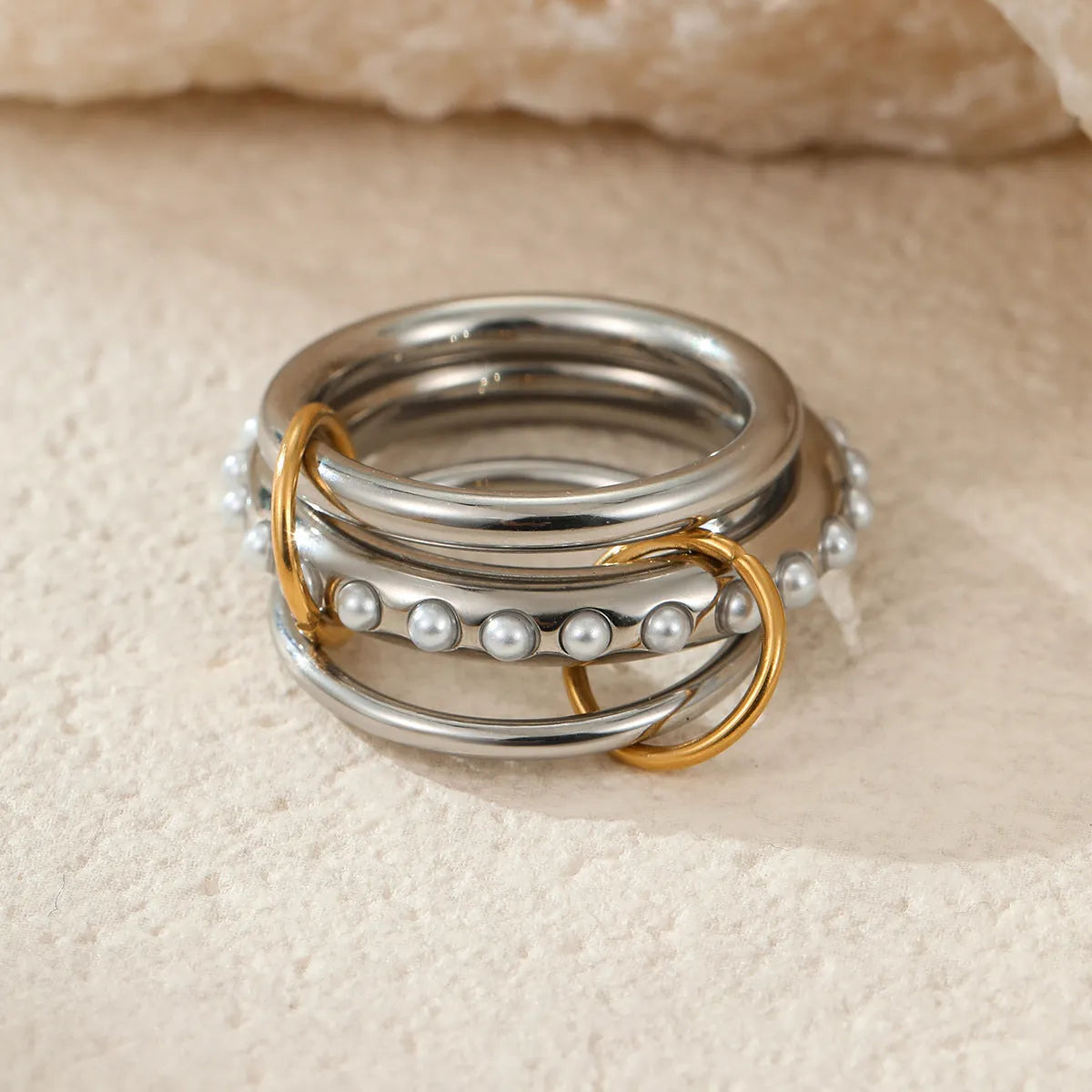 Stacked stainless steel women's ring with 18K gold plating in a colour-matched design.