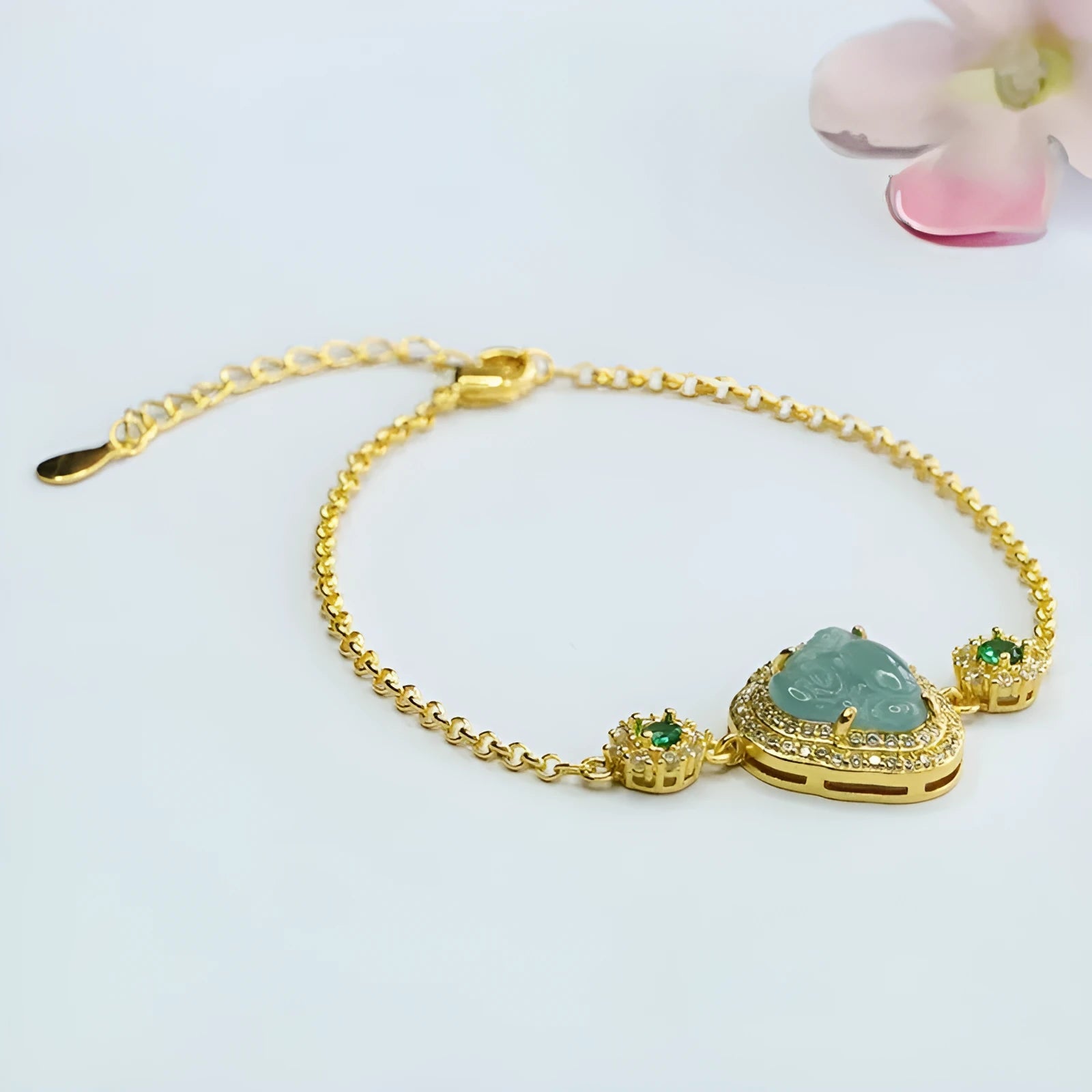 Jade bracelet with carved blue Maitreya Buddha charm and adjustable gold clasp